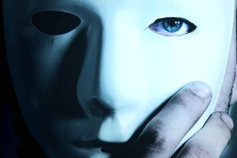 blue eyes peeking out of white mask