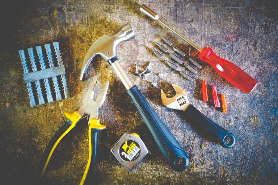 a collection of hardware tools on a scratched up background